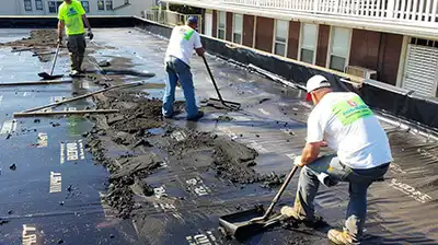 Roofix NY professional roofer inspecting commercial flat roof